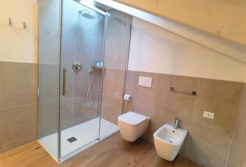 a bathroom with a shower and a toilet and a sink at Vivila - Ca' Foulard in Cernusco sul Naviglio