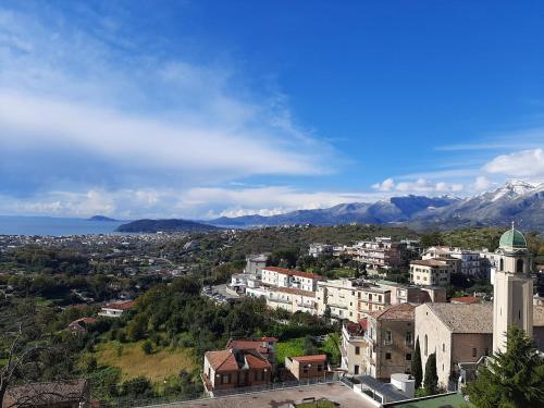 a view of a city with mountains in the background at Casa Annalisa in Scauri