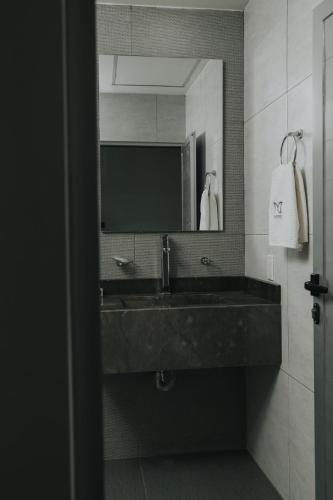 a bathroom with a sink and a mirror at MCI HOTEL in San Juan de los Lagos