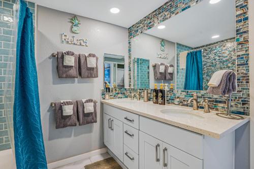 a bathroom with a sink and a mirror at Waikomo Stream Villas 322 in Koloa