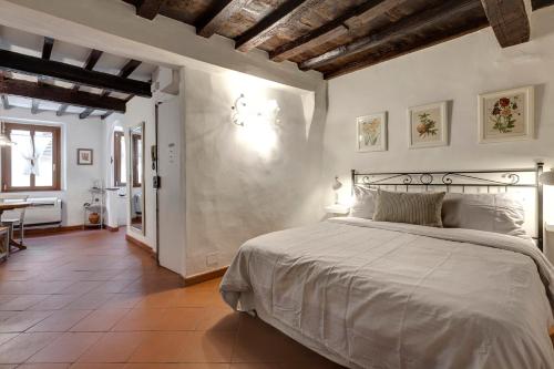 a bedroom with a bed and a table in a room at Florence Holiday Homes Santa Maria Novella in Florence