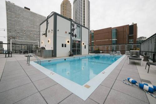 a large swimming pool on top of a building at Luxury Gold Coast Home w/ Rooftop Pool & Gym in Chicago