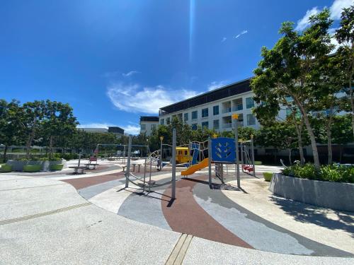 a park with a playground with a slide at Homesuite' Home at The Loft in Kota Kinabalu
