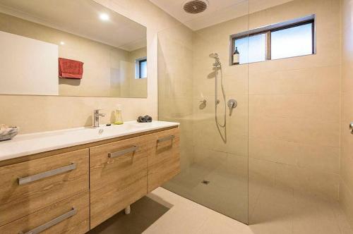 a bathroom with a shower and a sink at Salty in Quindalup