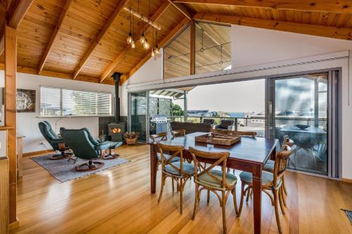 a dining room with a table and chairs at Heavenly Horizons in Dunsborough