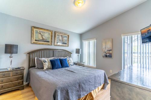a bedroom with a large bed with blue pillows at 17637 Silver Creek in Orlando