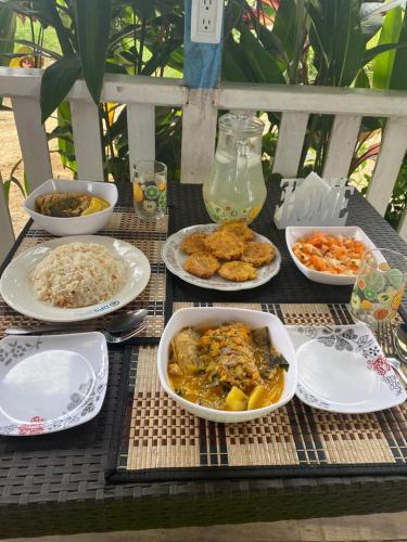 a table with plates of food on top of it at Villa Luz Ovelia in El Valle