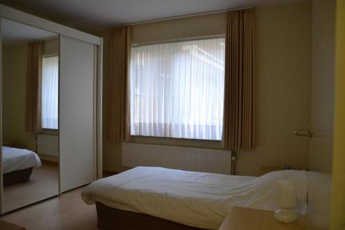 Giường trong phòng chung tại Lindehof Serviced Flats
