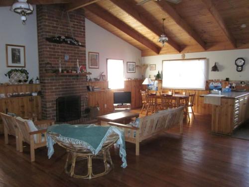 a large living room with a table and chairs at The Beach Break in Smiths Beach