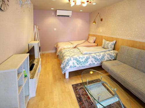 a small living room with a couch at Ocean Villa Tin Gala in Onna