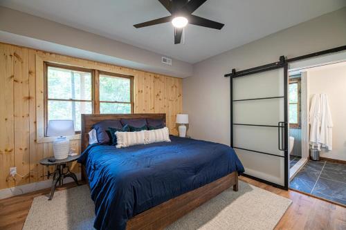 a bedroom with a bed and a ceiling fan at Hidden Mountain Gem in Gatlinburg