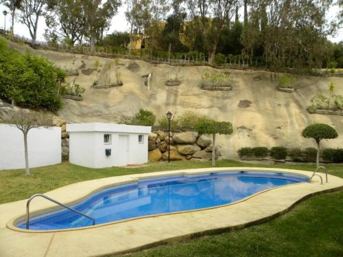 a large swimming pool in front of a large slide at Residential Oasis 25 in Mojácar