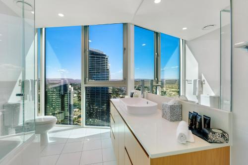 a bathroom with a view of a skyscraper at Hilton Five Star Panoramic Oceanview Sub-Penthouse in Gold Coast