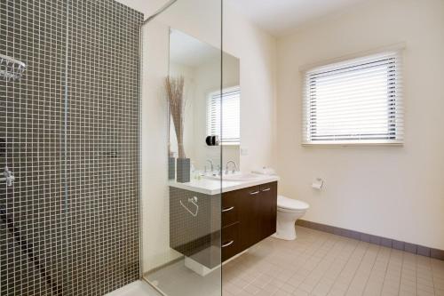 a bathroom with a shower and a sink and a toilet at Getaway on Church Free Wifi - Stay 4 Pay 3 - Promo code Getaway in Cowes