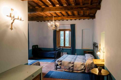 Postel nebo postele na pokoji v ubytování Agriturismo Bio Fattoria di Pietra
