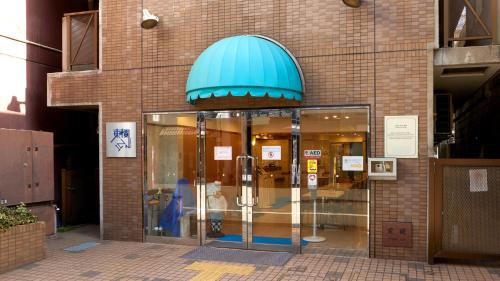 a store front with a blue dome on a building at Toyoko Inn Tokyo Otsuka-eki Kita-guchi No 1 in Tokyo