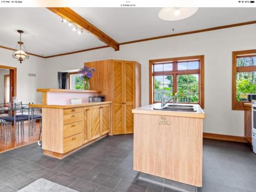 a kitchen with a sink and a counter top at Northern Holiday Cottage in Whangarei