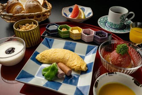 a table with a tray of breakfast foods and drinks at Gora Kadan in Hakone