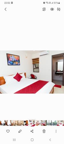 a room with two beds and a tv at Vĩnh Sơn Nội Bài in Hanoi