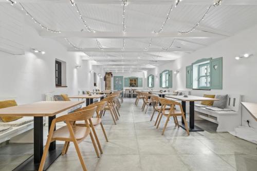 a row of tables and chairs in a room at Pension Regina in Český Krumlov