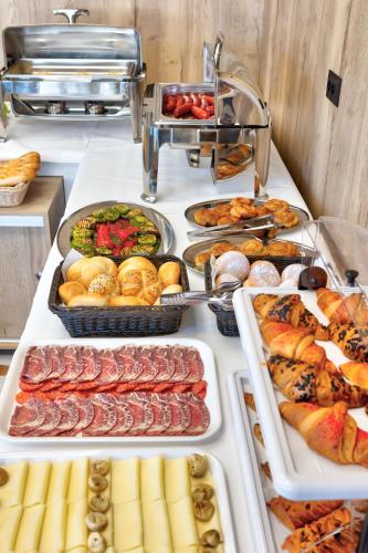 a buffet with many different types of food on display at Hotel Emerald in Mostar