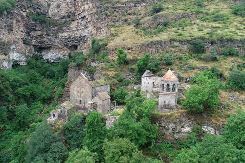an old building on the side of a mountain at Rafting House in Odzun