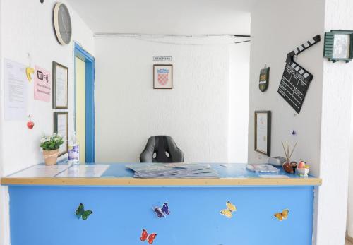 a desk in a room with a blue counter top at HI Hostel Dubrovnik in Dubrovnik