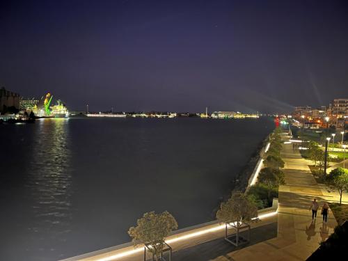 a view of a large body of water at night at AKS Honeysuckle in Newcastle