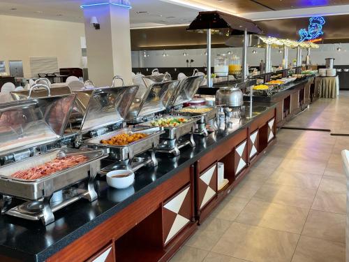 a buffet line with many different types of food at Hotel Maremons in Sokcho