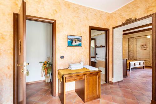 a room with a wooden table and a door at Luxury Accommodation in Santa Domenica