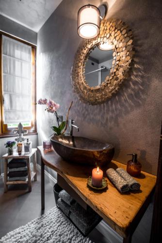 a bathroom with a vessel sink and a mirror at L'antica Fornace di Barale Emanuela in Vicoforte