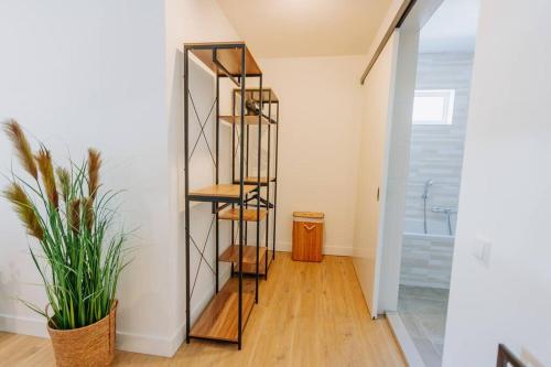 a hallway with a spiral staircase in a house at Brand new bright & luxurious villa in Amsterdam! in Amsterdam