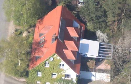 an aerial view of a house with an orange roof at Ferienwohnung Amselstieg Dr Meier in Bad Bevensen