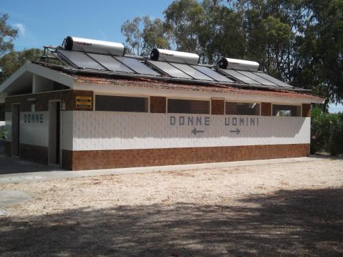 a building with a solarium on top of it at Camping Tellina in Manfredonia