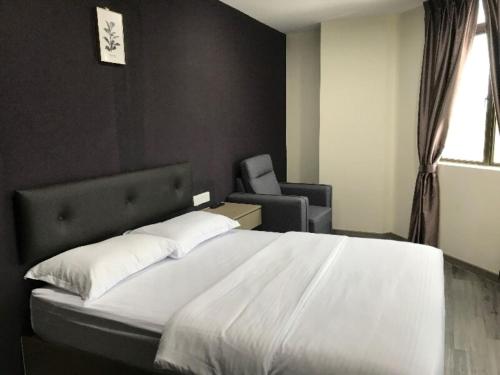 Postel nebo postele na pokoji v ubytování Z Stay Inn Hotel