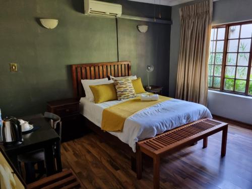 Katil atau katil-katil dalam bilik di Sanloo manor guesthouse