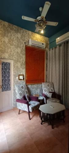 a living room with a couch and a table at Ranjit's Svaasa Amritsar in Amritsar