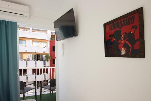 a poster of a movie hanging on a wall at Hotel Boogaloo - Adults Only in El Arenal