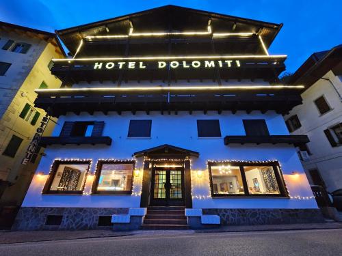a hotel doolin lit up at night at Hotel TEA DOLOMITI - Lago di Alleghe - Monte Civetta in Alleghe