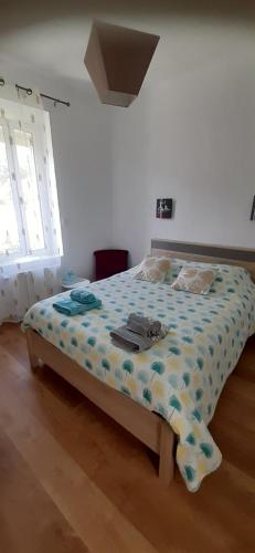 Ένα ή περισσότερα κρεβάτια σε δωμάτιο στο Chez Véro
