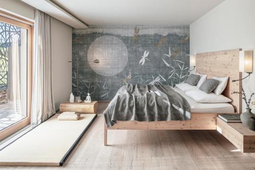 a bedroom with a bed and a wall at SILENA, your soulful hotel - adults only in Valles