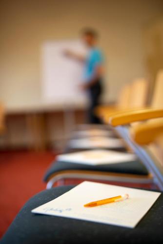 a pencil sitting on a table in a classroom at Hotel des Glücks - Landhotel Fischl in Sankt Oswald