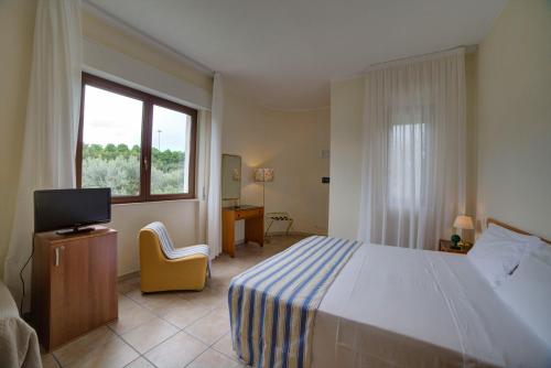Postel nebo postele na pokoji v ubytování Hotel Sporting