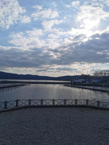 a bridge over a large body of water at Apartmán s terasou a výhledem na jezero Lipno in Kovářov