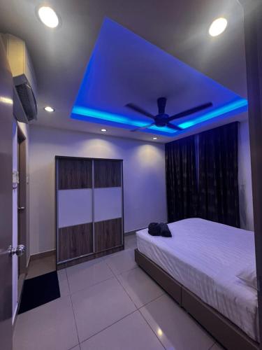 a bedroom with a bed with a blue ceiling at Nilam 3 Cozy Homestay Cyber City 3BR Near KKIA 10 minutes KK Centre wifi 30mps astro channel in Kapayan