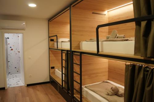 a room with two bunk beds in a room at Hostel Stadion - Zadar in Zadar