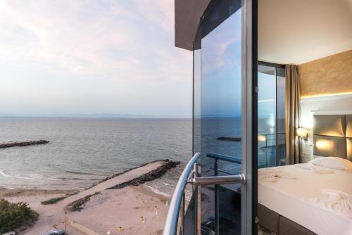 a balcony with a view of the ocean at СЛЪНЧЕВ ЗАЛИВ in Pomorie