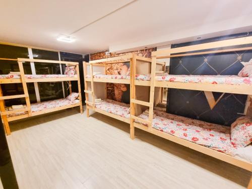 a room with multiple bunk beds in it at Unique City Hostel 100 meters from Beach in Larnaca