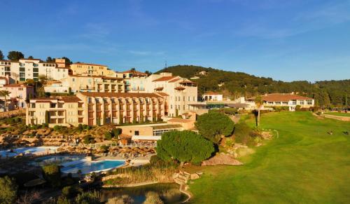 a view of a resort with a river and buildings at Le Fregate Provence in Bandol