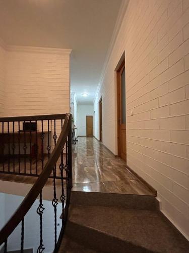 an empty hallway with a staircase in a building at Olesya Guesthouse in Mtsvane Kontskhi